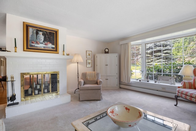 carpeted living room featuring a baseboard heating unit, a fireplace, and a textured ceiling