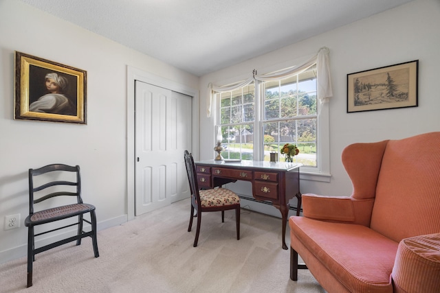 carpeted office with a baseboard heating unit