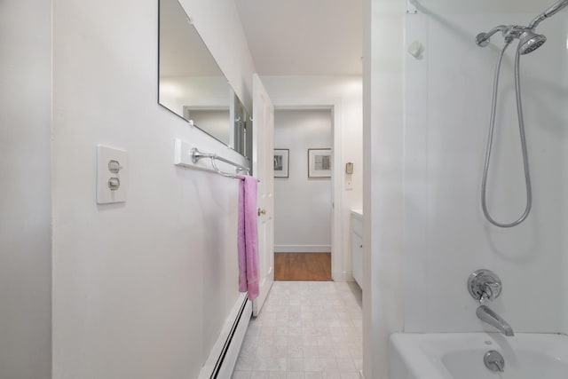 bathroom with bathtub / shower combination, vanity, tile patterned flooring, and baseboard heating