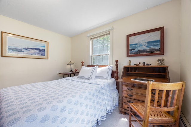 carpeted bedroom with a baseboard heating unit