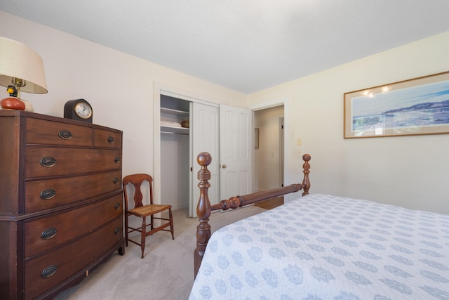 bedroom with a closet and light colored carpet