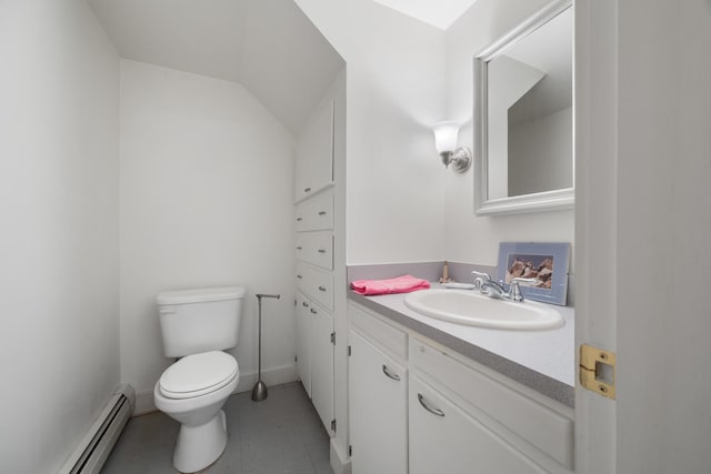 bathroom with tile patterned floors, vanity, toilet, and a baseboard radiator