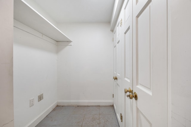 walk in closet featuring light tile patterned floors