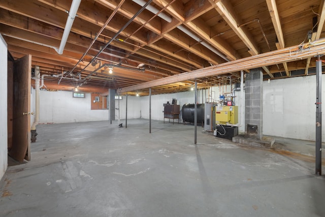 basement featuring electric water heater