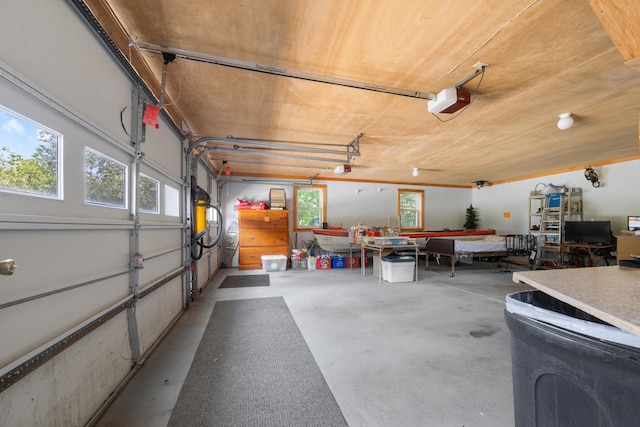 garage with a garage door opener and wood ceiling