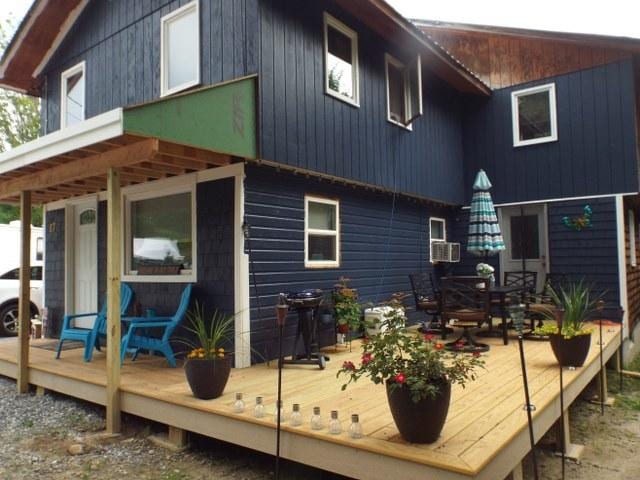 rear view of property with a wooden deck