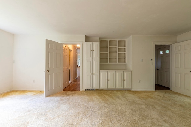 unfurnished bedroom with light carpet