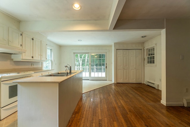 kitchen with baseboard heating, wood-type flooring, sink, white cabinetry, and white stove