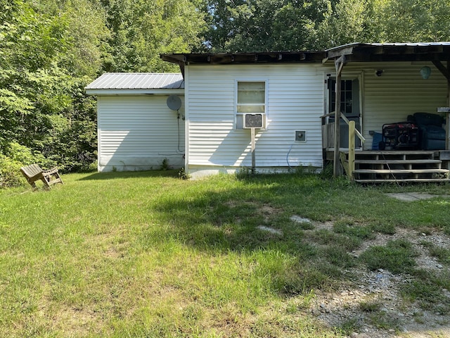 24 Spruce Ln, Dixmont, ME 04932 - rear view of property with metal roof, an attached carport, and a yard