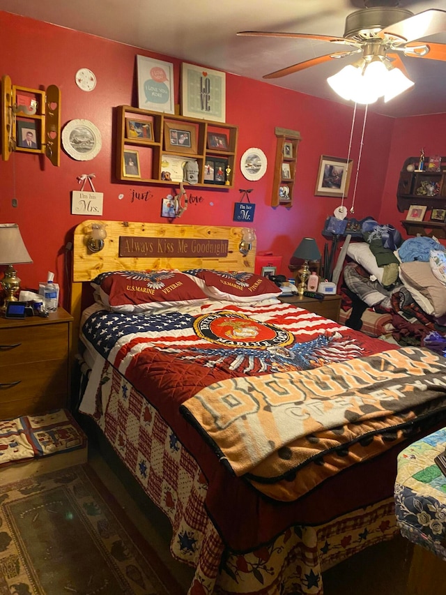 bedroom featuring ceiling fan and dark hardwood / wood-style floors