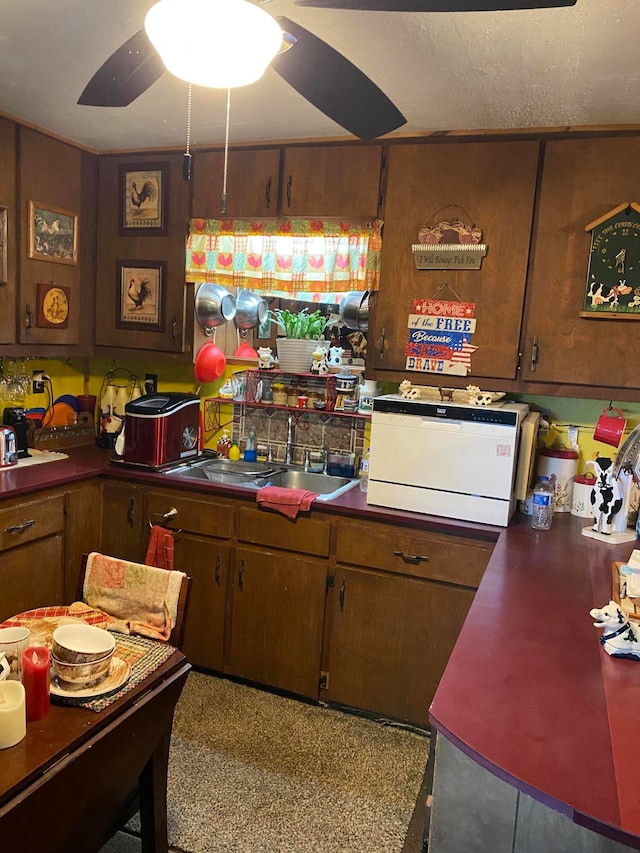 kitchen with ceiling fan and a textured ceiling