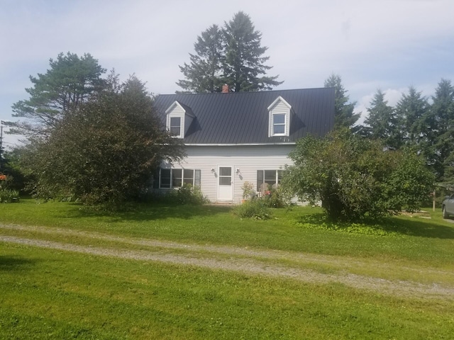 381 Caribou Rd, Presque Isle, ME 04769 - view of side of property featuring a yard, a metal roof, and a chimney