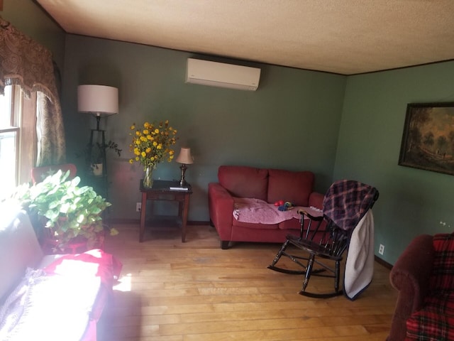 381 Caribou Rd, Presque Isle, ME 04769 - living area with a wall mounted AC and hardwood / wood-style floors