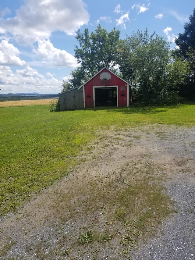 381 Caribou Rd, Presque Isle, ME 04769 - view of pole building with a yard and driveway