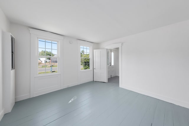 unfurnished room featuring wood-type flooring