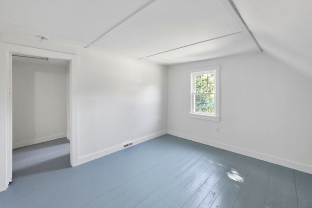 bonus room with lofted ceiling and hardwood / wood-style floors