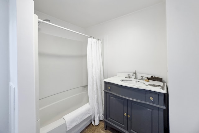 bathroom featuring crown molding, vanity, and shower / bathtub combination with curtain