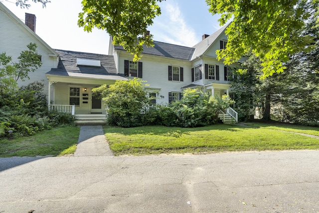 4 Wilson St, Topsham, ME 04086 - view of front facade featuring covered porch and a front yard