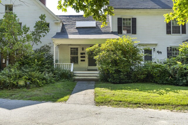 4 Wilson St, Topsham, ME 04086 - view of front of house with covered porch and a front yard