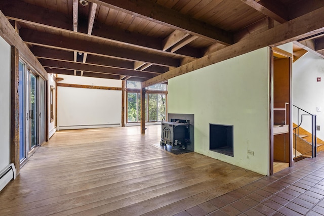 4 Wilson St, Topsham, ME 04086 - unfurnished living room featuring a wood stove, a wood ceiling with exposed beams, a baseboard radiator, wood finished floors, and a baseboard heating unit