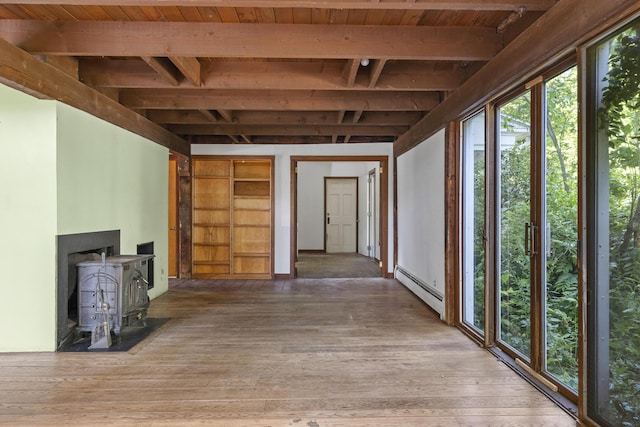 4 Wilson St, Topsham, ME 04086 - unfurnished living room featuring baseboard heating, a wood stove, a wooden ceiling with exposed beams, and wood-type flooring