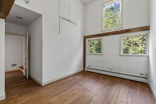 4 Wilson St, Topsham, ME 04086 - spare room featuring a baseboard radiator and wood-type flooring