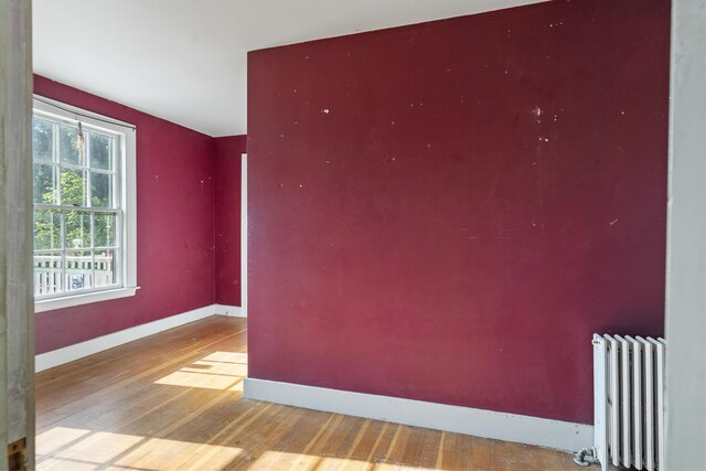 4 Wilson St, Topsham, ME 04086 - spare room with radiator and wood finished floors