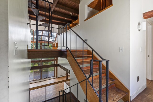 4 Wilson St, Topsham, ME 04086 - stairway with a wooden ceiling with exposed beams, wood finished floors, plenty of natural light, and a towering ceiling