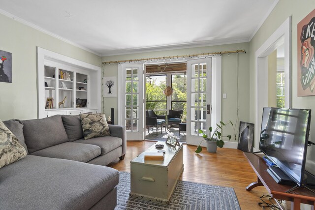 4 Wilson St, Topsham, ME 04086 - living room with crown molding, french doors, and wood finished floors