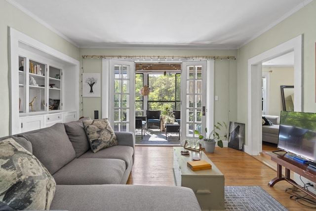 4 Wilson St, Topsham, ME 04086 - living area featuring ornamental molding, wood finished floors, and french doors