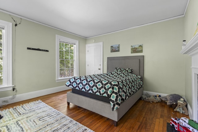 4 Wilson St, Topsham, ME 04086 - bedroom with hardwood / wood-style floors, crown molding, and a fireplace