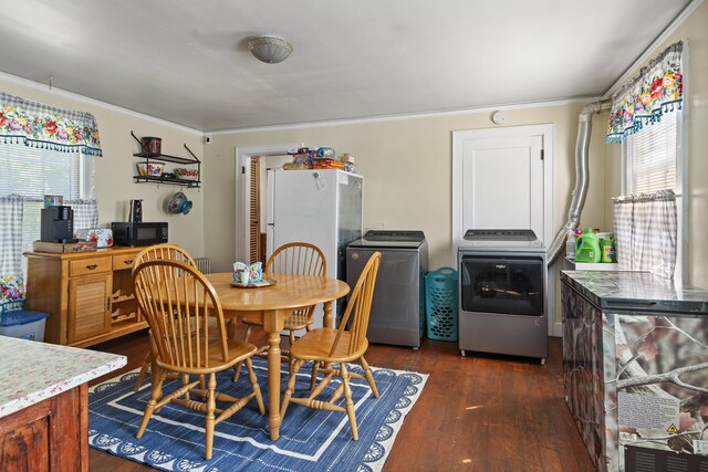 4 Wilson St, Topsham, ME 04086 - dining room with dark wood-type flooring, ornamental molding, and separate washer and dryer