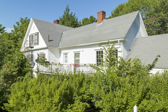 4 Wilson St, Topsham, ME 04086 - back of house with a chimney and a deck