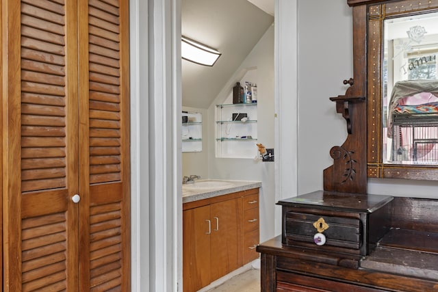 4 Wilson St, Topsham, ME 04086 - bathroom with lofted ceiling, vanity, and a closet