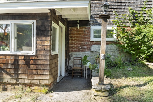 4 Wilson St, Topsham, ME 04086 - doorway to property featuring brick siding