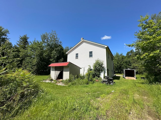 view of home's exterior featuring a storage shed