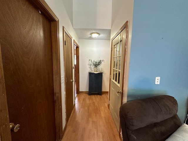 corridor featuring light hardwood / wood-style flooring