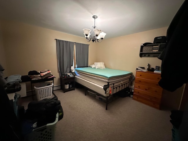 bedroom featuring a baseboard heating unit, a chandelier, and carpet flooring