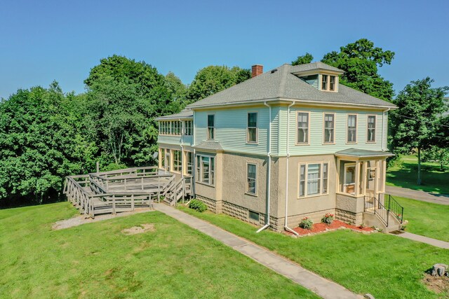443 S Union Rd, Union, ME 04862 - back of property featuring a lawn, a deck, a shingled roof, and a chimney