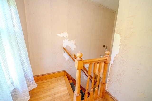 stairway featuring hardwood / wood-style floors