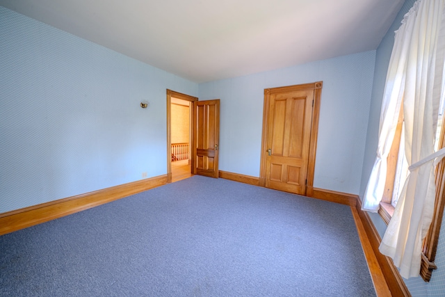 unfurnished bedroom featuring carpet flooring