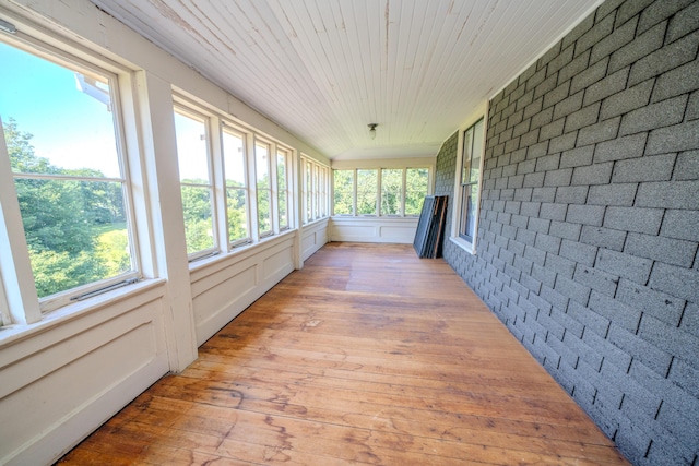 443 S Union Rd, Union, ME 04862 - unfurnished sunroom with brick wall, a wealth of natural light, and hardwood / wood-style floors