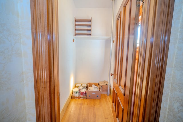 corridor with light wood-type flooring