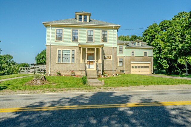 443 S Union Rd, Union, ME 04862 - american foursquare style home with a garage, a front lawn, and driveway