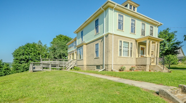 view of home's exterior with a yard