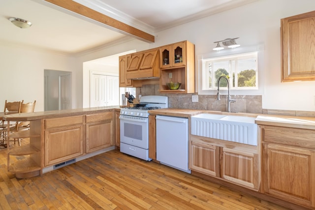 kitchen featuring open shelves, white appliances, a peninsula, and light wood finished floors