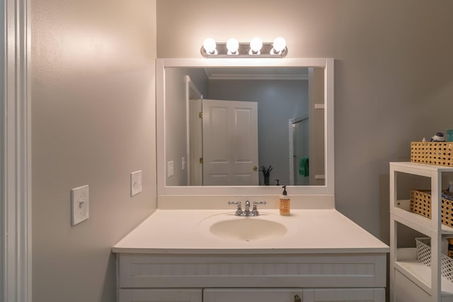 bathroom featuring vanity and ornamental molding