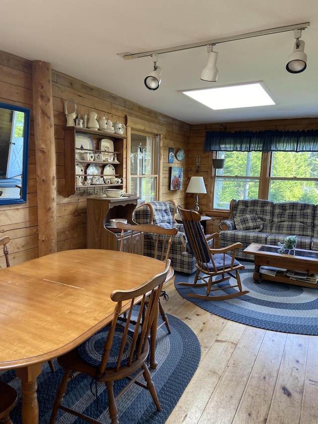 91 Mcsorley Rd, Great Cranberry, Cranberry Isles, ME 04625 - dining space featuring wooden walls, track lighting, and hardwood / wood-style flooring