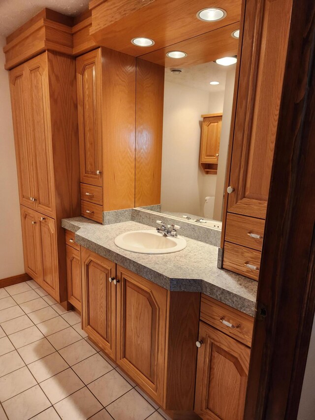 bathroom featuring vanity and tile patterned flooring