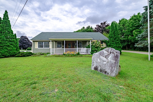 ranch-style house with a porch and a front yard